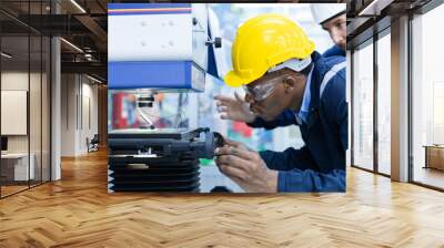 Specialist male African American engineer workers in manufacturing factory workplace. Microchip testing staff Operations of robots in industrial plants. Trade and research parts, modern production. Wall mural