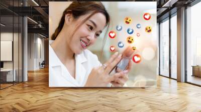 woman using smartphone with social media icons. Online digital communication connection information with mobile phone. Contact us and social media online concept. Wall mural