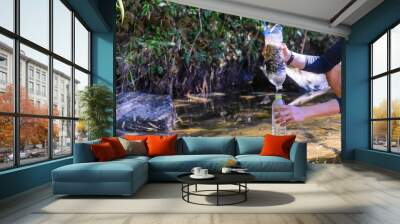 Simple natural water filtering gear use for outdoor camping. Wall mural