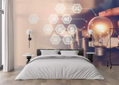 Hand choose light bulb with bright and icons for creative idea concept or innovation of technology in analyzing global marketing online business data management services to target growth concept. Wall mural