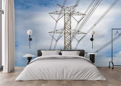 High-voltage transmission tower and wiring cable with sky background. Wall mural