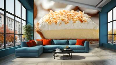 Delicious coconut cream pie slice topped with whipped cream and toasted coconut flakes, set against a rustic background. Wall mural