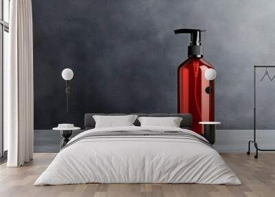 Elegant red bottle with pump against a textured gray background, perfect for cosmetic or personal care product presentations. Wall mural