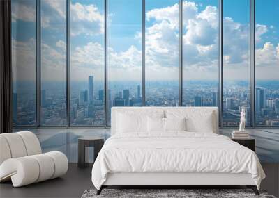 Stunning city skyline view from modern office with large glass windows under a bright blue sky with fluffy clouds. Wall mural