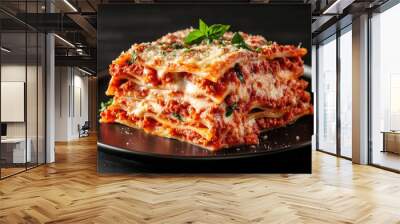 Lasagna isolated on black background. Italian cuisine traditional dish Wall mural