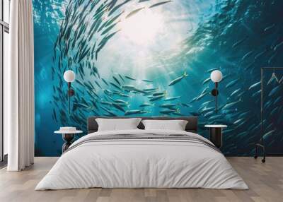 Fish in the ocean. A large school of fish swim in circles in the ocean. Wall mural