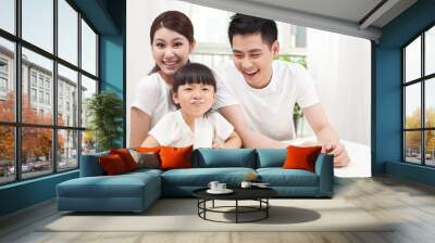 A happy family of three and milk Wall mural