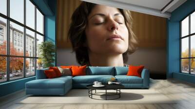 Portrait of a beautiful young woman with closed eyes and closed eyes Wall mural