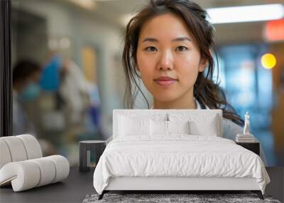 portrait of a female asian doctor in the hospital, smiling woman, stethoscope Wall mural