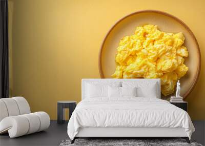 tasty scrambled egg on a plate on a clear background with copy space for text, top view Wall mural