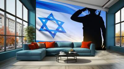 Silhouette of soldier saluting with Israel flag on background of sunrise or sunset. Armed forces of Israel concept Wall mural