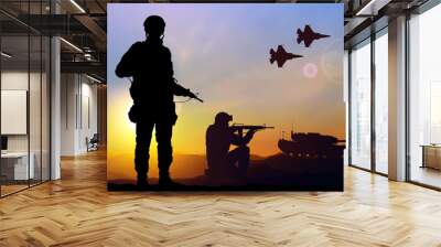 Silhouettes of a soliders with main battle tank and military airplanes against the sunset. EPS10 vector Wall mural