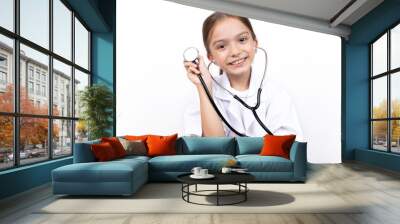 Portrait of child girl dressed in white doctor costume with stethoscope. isolated on white background.
 Wall mural