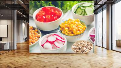 Assortment ingredients for healthy vegetarian salad in different portion bowls on a table. The concept of fitness and vegan food. Wall mural