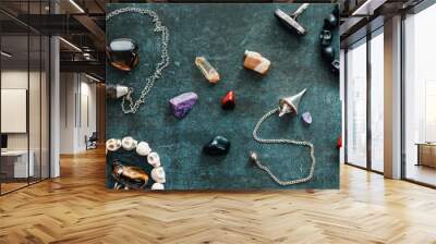 Magic flat lay. Various precious and semiprecious stones on a blue background for witchcraft. Wall mural