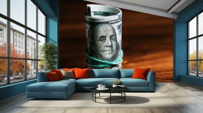 One hundred dollar bills on a table. Copy space. Wall mural