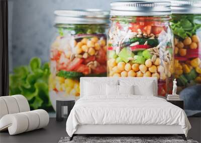 Three glass jars with layering various vegan salads for healthy lunch. The concept of fitness and vegetarian food. Wall mural