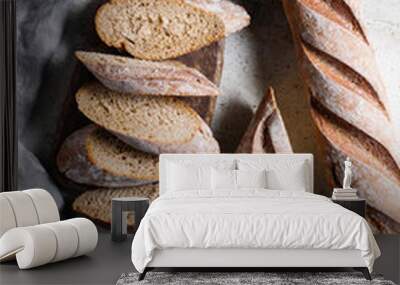 Top view of two brown baguettes on a concrete background. Wall mural