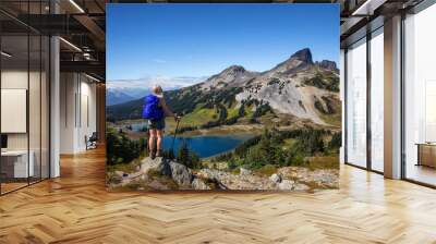 Adventurous girl enjoying the beautiful Canadian Mountain Landscape during a vibrant summer day. Taken in Garibaldi Provincial Park, located near Whister and Squamish, North of Vancouver, BC, Canada. Wall mural