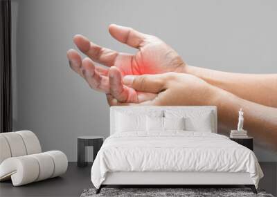 Pain in the palm of hand caused by bruising or injuring, Isolated on a gray wall background. Wall mural