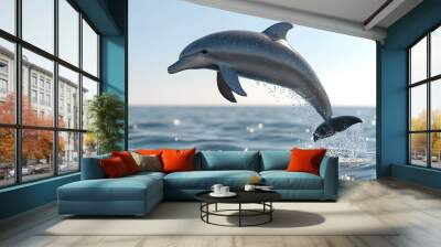 A dolphin leaps from the ocean, its sleek body illuminated by the sun. Wall mural