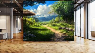 A rustic path winds through a lush green landscape, leading to a distant mountain range under a clear blue sky. Wall mural