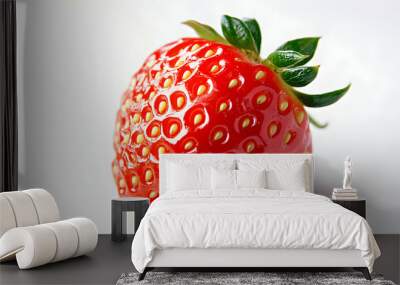 Close-up image of a ripe, red strawberry on a white background. Wall mural