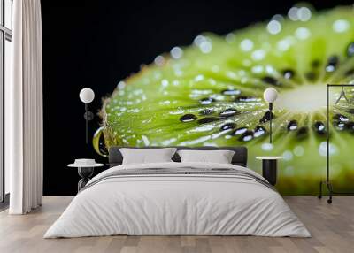 Close-up of a juicy kiwi slice with water droplets. Wall mural