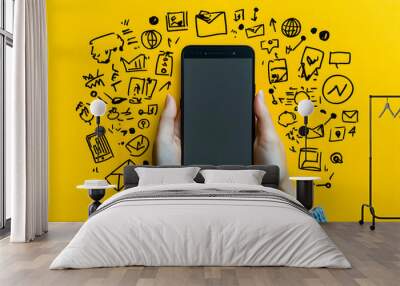 Hands holding smartphone with social media icons drawn around it. Wall mural