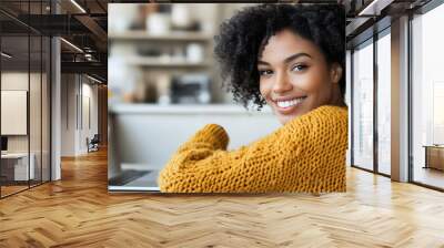 Happy woman working on laptop in cozy home office. Wall mural