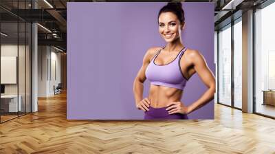 portrait of a sporty beautiful woman with smooth perfect skin with purple sports outfit in purple backround 300dpi Wall mural