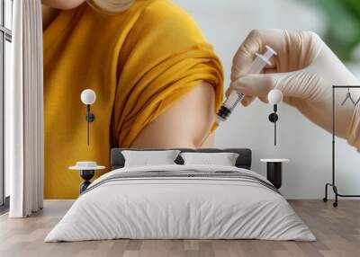 Close-up of a female arm being injected with a syringe for a medical procedure.  Wall mural