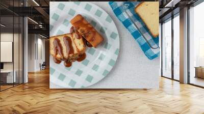 top view of two slices of walnut bread with cajeta on a plate on a table Wall mural