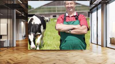 farmer with milk churns at his cows Wall mural