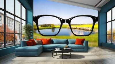 Glasses against natural scenery Wall mural