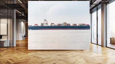 A cargo ship delivers a lot of containers with goods from China. Sea shipment and transportation industry Wall mural