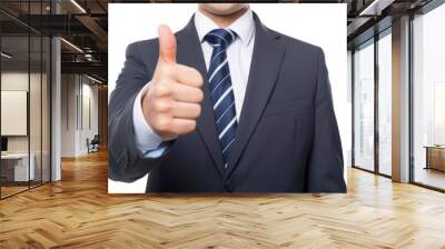 A confident businessman in a suit giving a thumbs-up gesture, signifying success and approval in a business deal or agreement. Wall mural