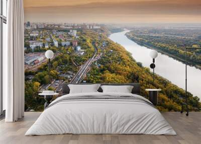 Aerial view of the picturesque autumn river in the suburbs of an industrial city and the transport railway road Wall mural