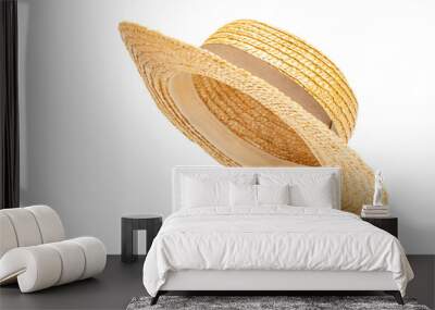 Boater straw hat flying isolated in studio. Concept of fashion clothing accessories and beach holidays Wall mural