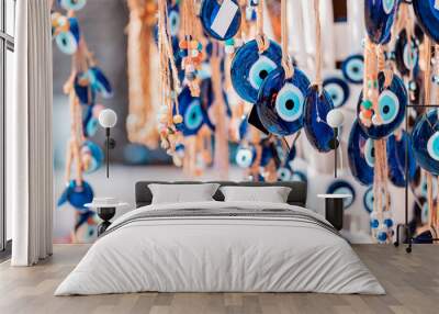 evil eye turkish bead amulets hanging in souvenir store. gift and superstitions concept Wall mural