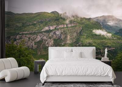 Montenegro's breathtaking mountains offer a stunning view of the Balkans landscape, with lush green forests and rocky peaks inviting travelers to explore the scenic beauty Wall mural