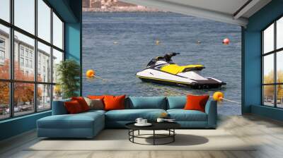 Sea scooter and aquabike are moored to the shore and are waiting for vacationers and extreme athletes at the resort. Water sports and entertainment Wall mural