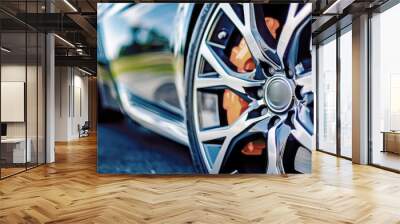 tires with powerful disc brakes pads on a sports racing luxury car. Wall mural