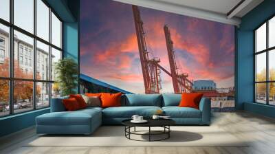 container cargo freight ship at sunset Wall mural