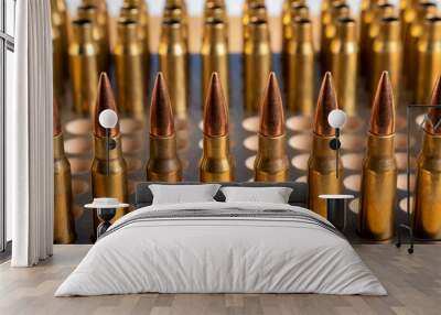 Production of cartridges for a rifle, reload. Empty shells and ammunition. Close up Wall mural