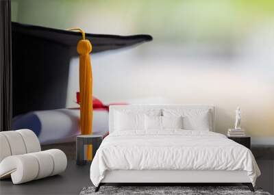 close-up of a mortarboard and degree certificate put on table. education stock photo Wall mural