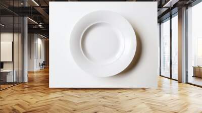 Empty white plate standing on white table background Wall mural