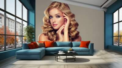 Beautiful girl  blonde hair with an elegant hairstyle , hair wave ,curly hairstyle . Jewellery , earrings and bracelet Wall mural