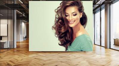 Beautiful model girl with long wavy and shiny hair . Brunette woman with curly hairstyle

 Wall mural