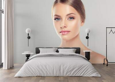 Beautiful Young Woman with Clean Fresh Skin . Facial  treatment   . Cosmetology , beauty  and spa .
 Wall mural